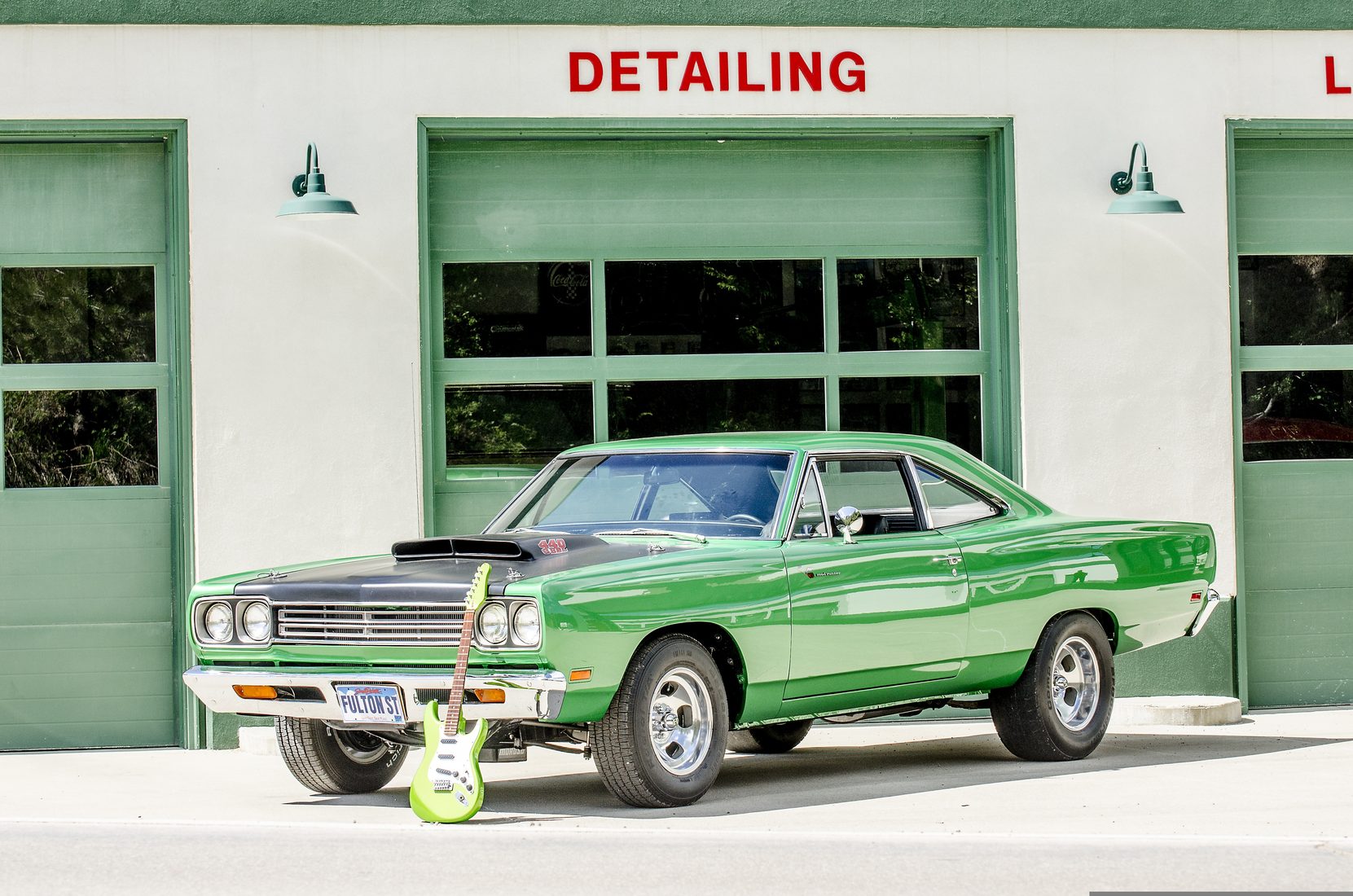 A muscle car outside a detailing workshop